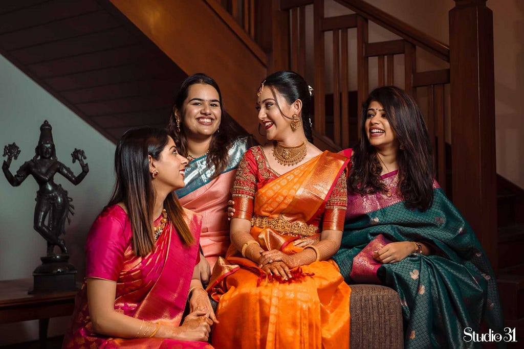 A gorgeous bride with her bridesmaids at Taj Connemara, Chennai by Studio 31