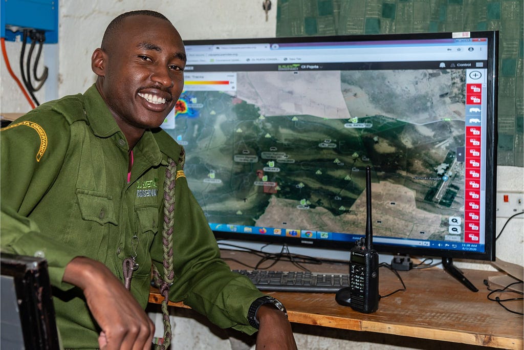 A ranger at Ol Pejeta Conservancy in Kenya with EarthRanger in the background.
