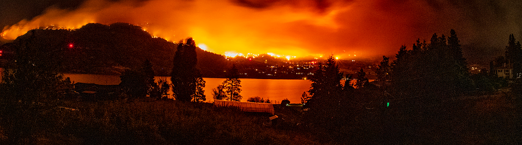 A forest fire burns in the Okanagan Valley lighting up the night sky.