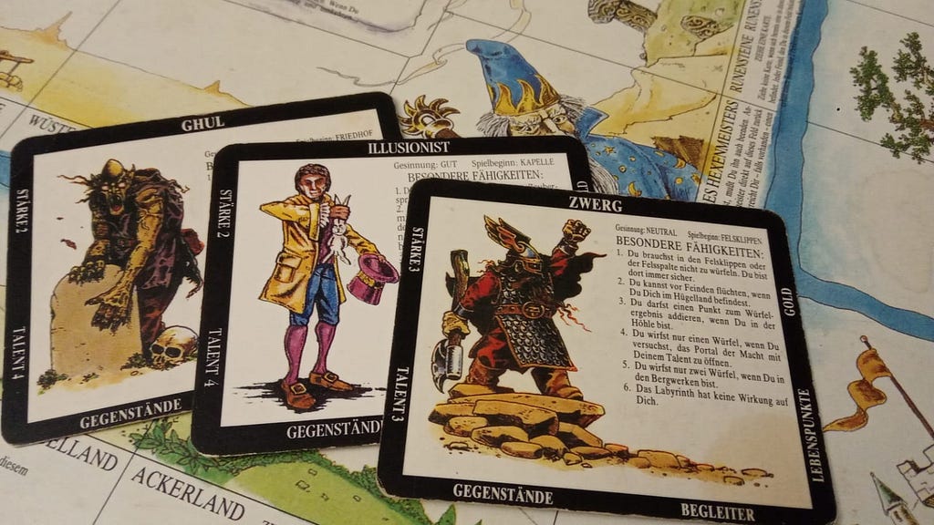 character cards on the board of “Talisman” board game