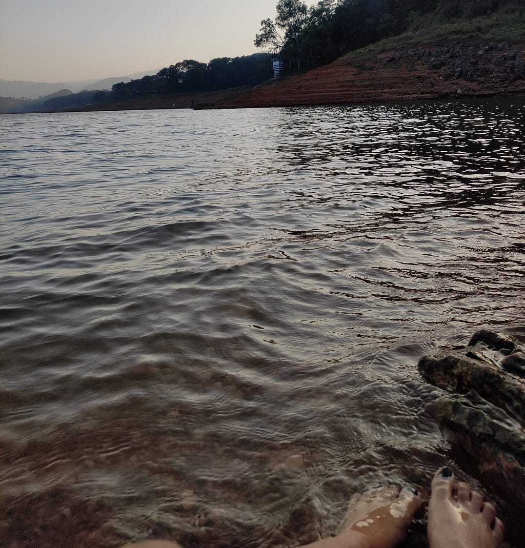 An evening by the lake watching the sunset with my feet under water