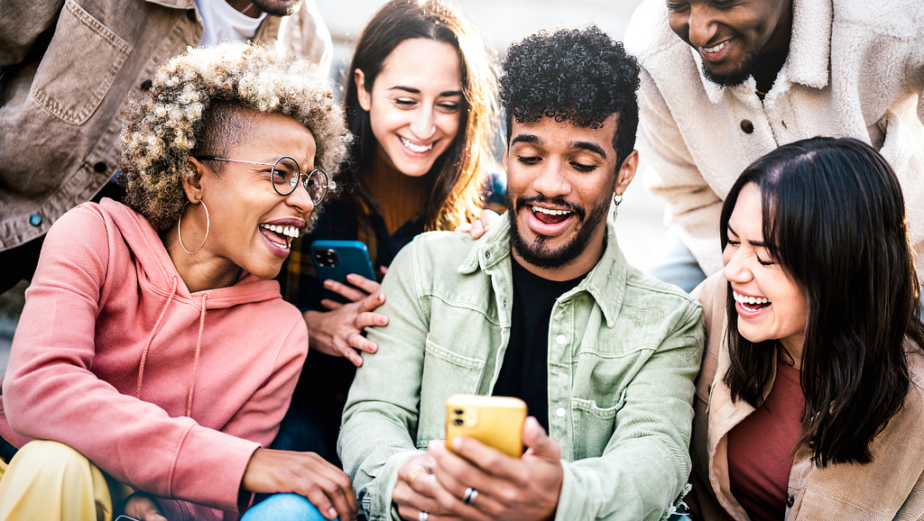 Your social media is where many people — Gen Z included — will meet your institution. So make it count, and be sure you inspire the kind of excitement this group of people watching a video together are experiencing.