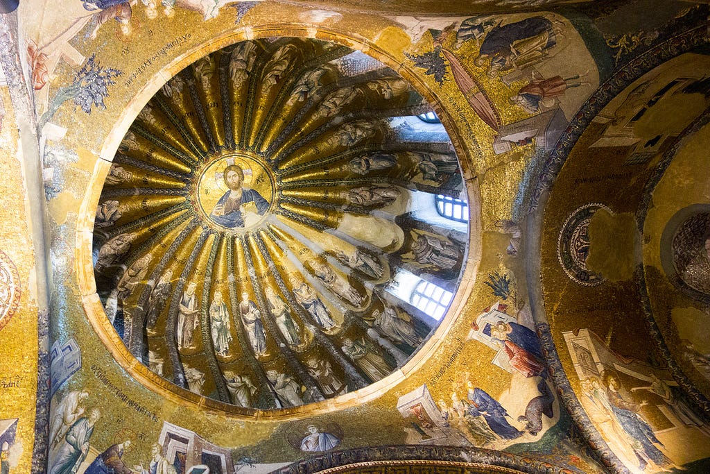 a gold ceiling and dome covered in mosaic tiles