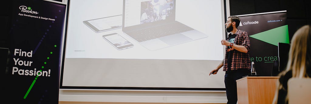 A man delivering a presentation at an IT meetup