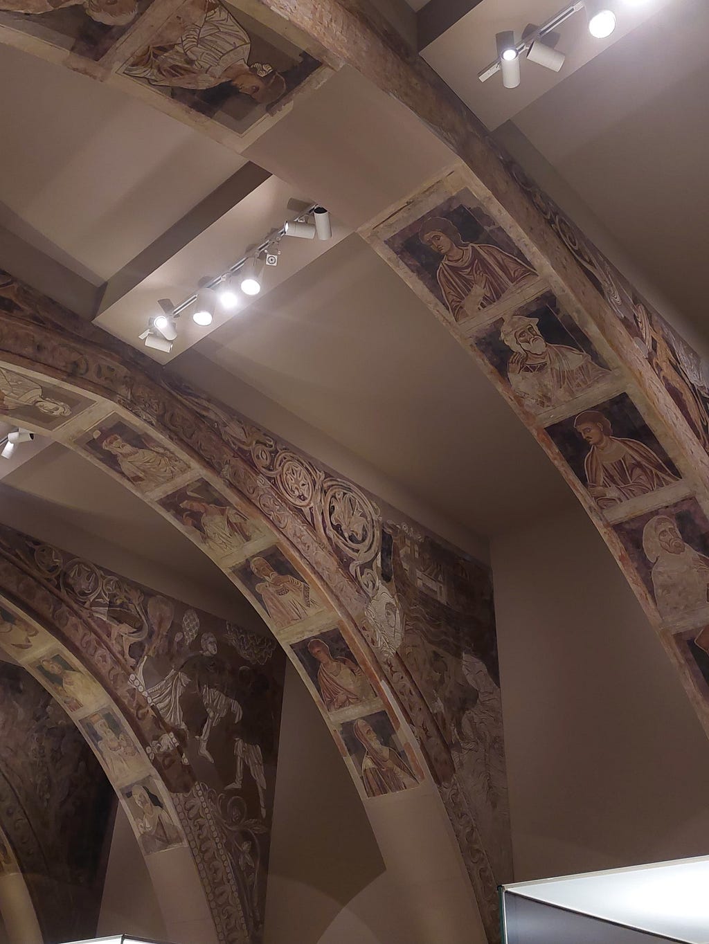 Ceiling of one of the exhibition rooms at the National Art Museum of Catalonia, full of images of saints.