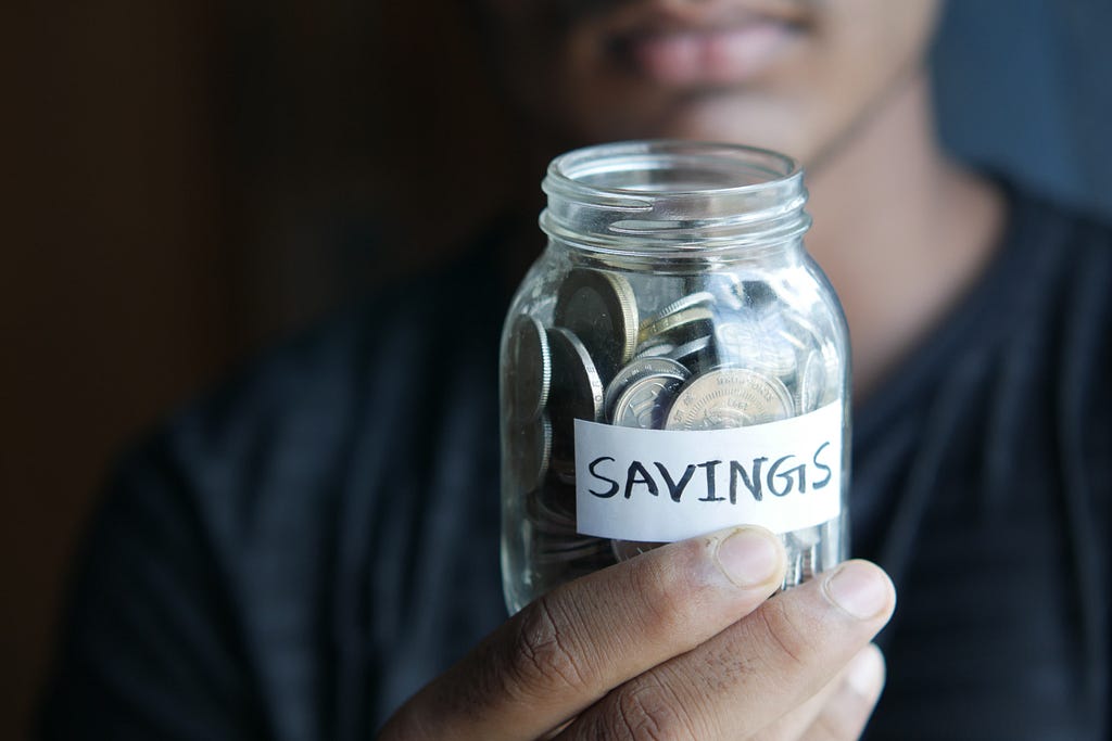 Coins in a savings jar to represent how much you save when buying ukay-ukay