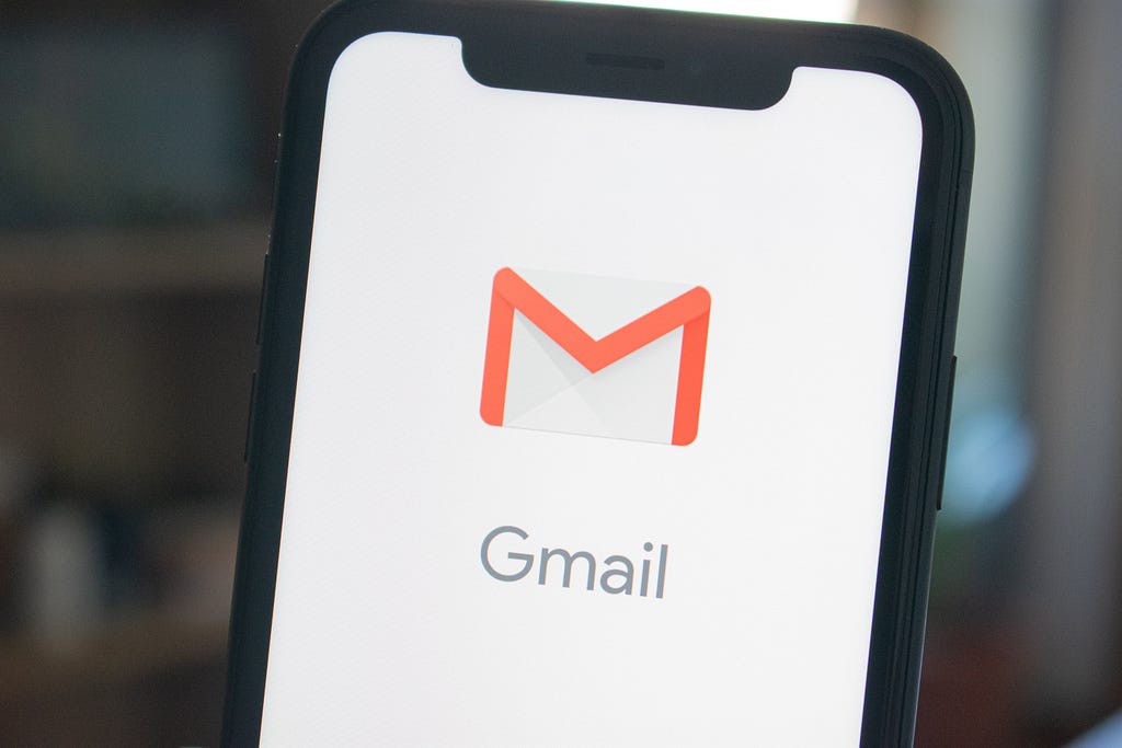 A phone with the Gmail app loading