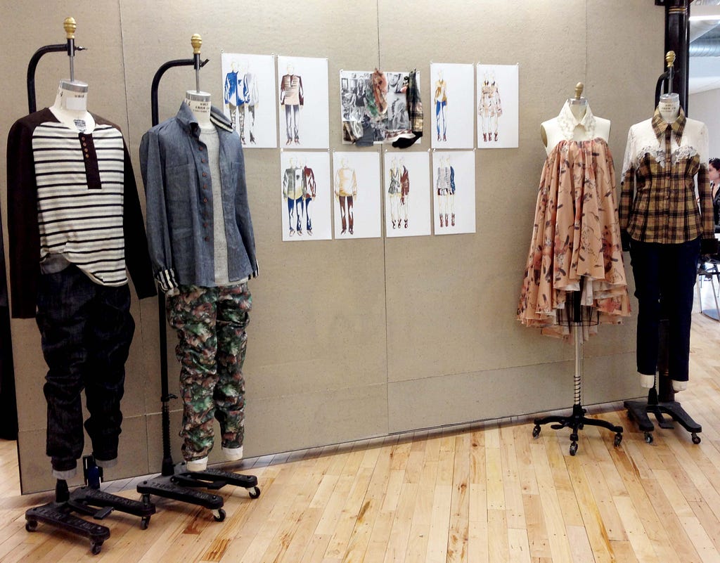 Two mens outfits and two women's outfits displayed near illustrations of the garments.