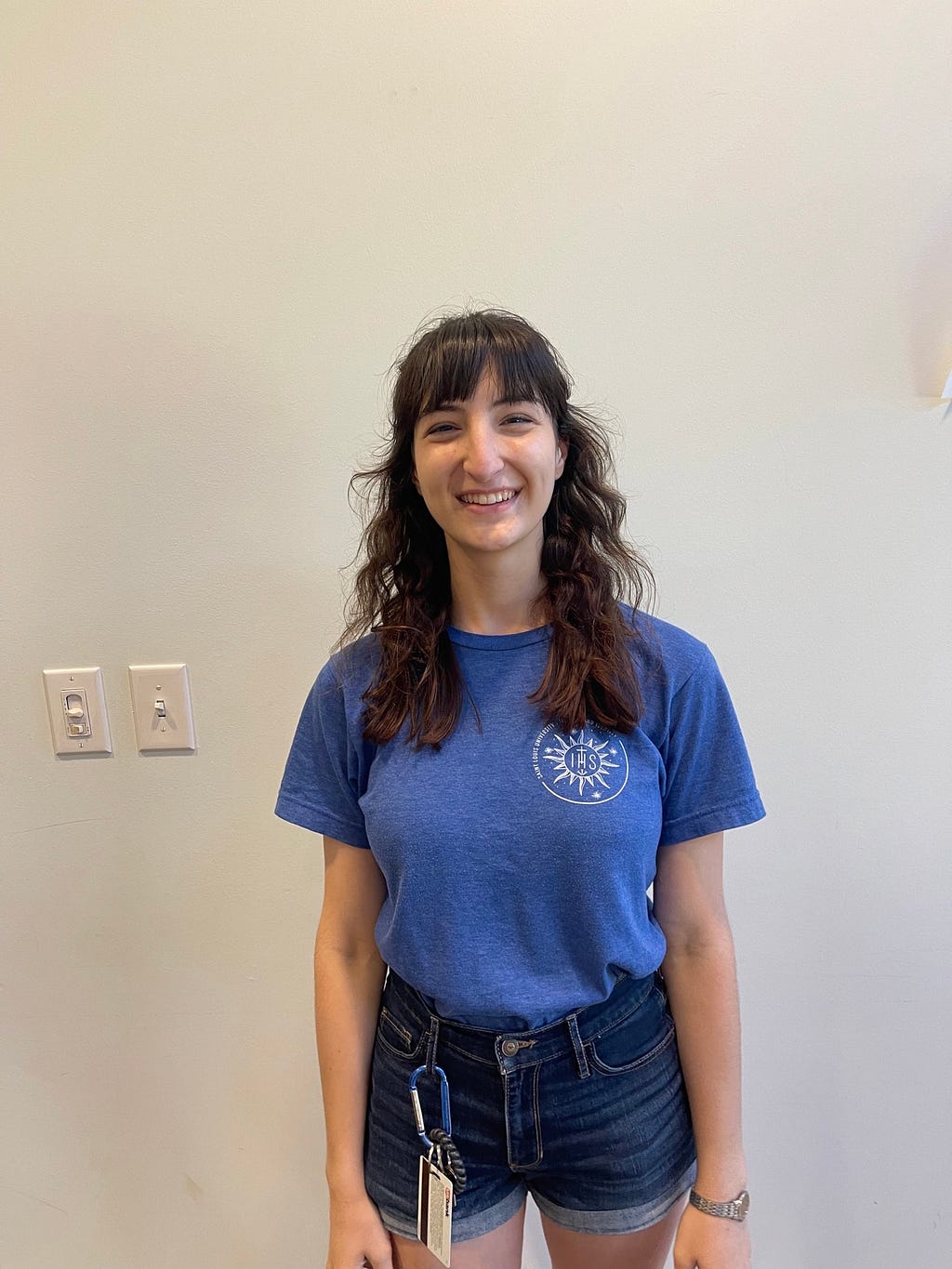 Sarah Erickson, senior at Saint Louis University, standing and smiling in the Center for Global Citizenship on Saint Louis Universities’ campus on August 31st, 2022 at 4:00 pm. Photo by Lauren Morby