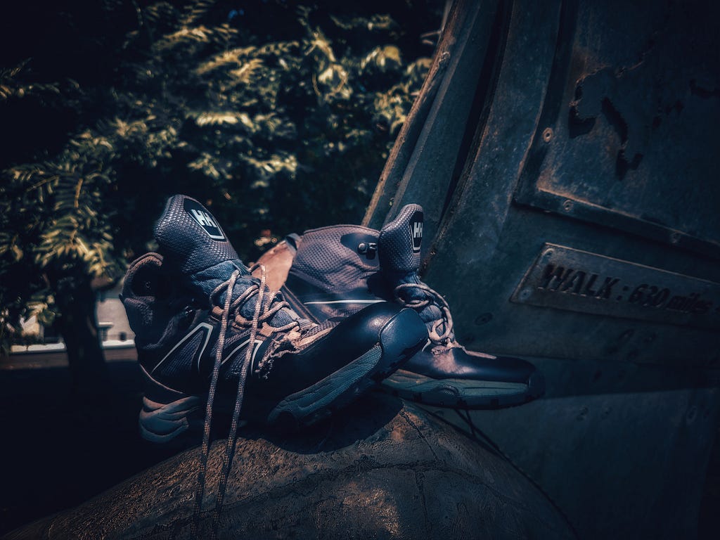 Ripped walking boots on the monument