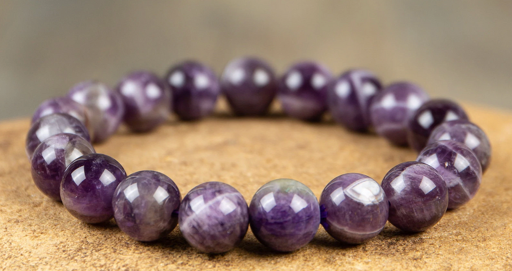 Purple bracelet made of round amethyst stones.