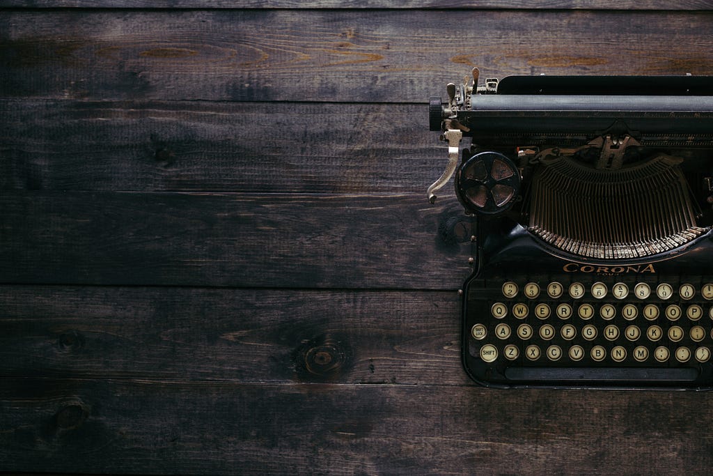 A typewriter — Photo courtesy of Patrick Fore and Unsplash