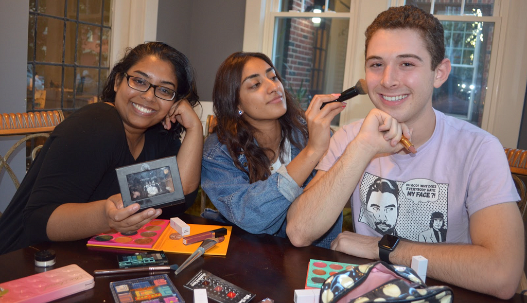 An image of our team playing around with makeup. Left is Sabrina Moin, center is Anisha Matharu, and right is me!