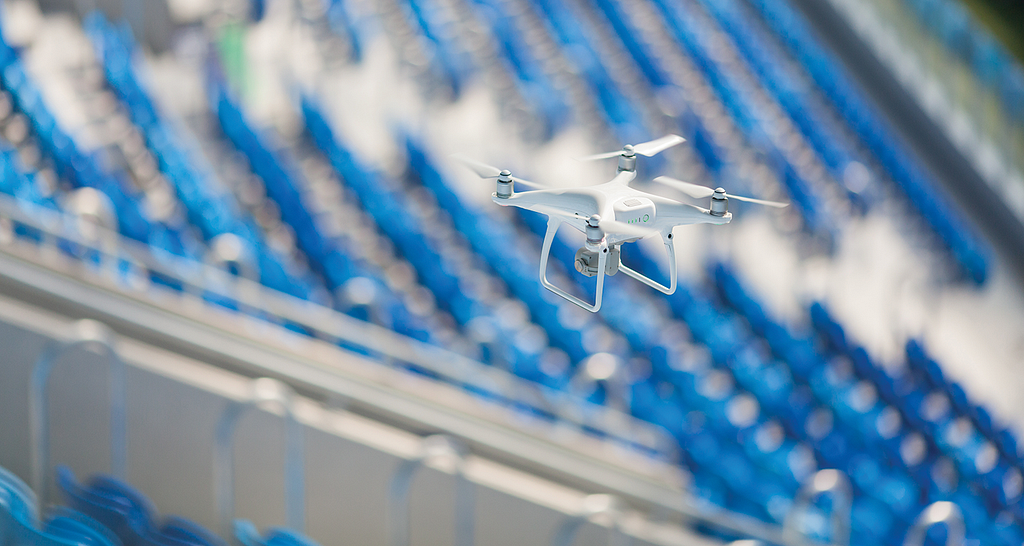 Drone flying over a stadium.