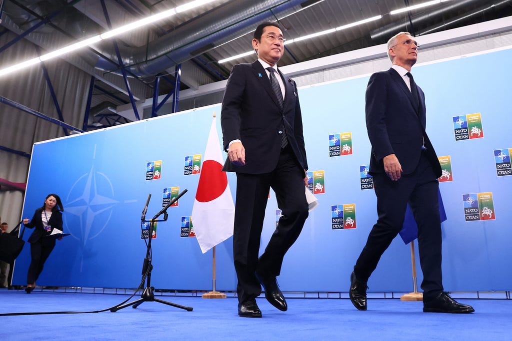 Japanese Prime Minister Fumio Kishida and NATO Secretary-General Jens Stoltenberg meet during a NATO summit in Vilnius, Lithuania, July 12, 2023. Photo by Yves Herman/Reuters