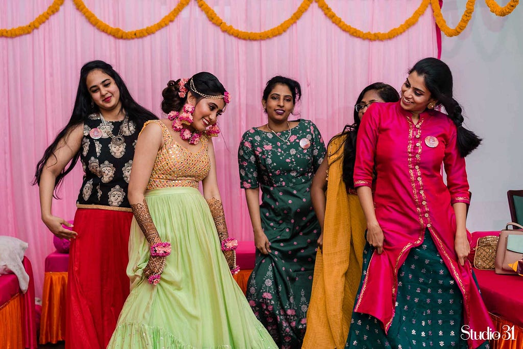 Candid photography from a sangeet ceremony at Trident Hotel, Chennai