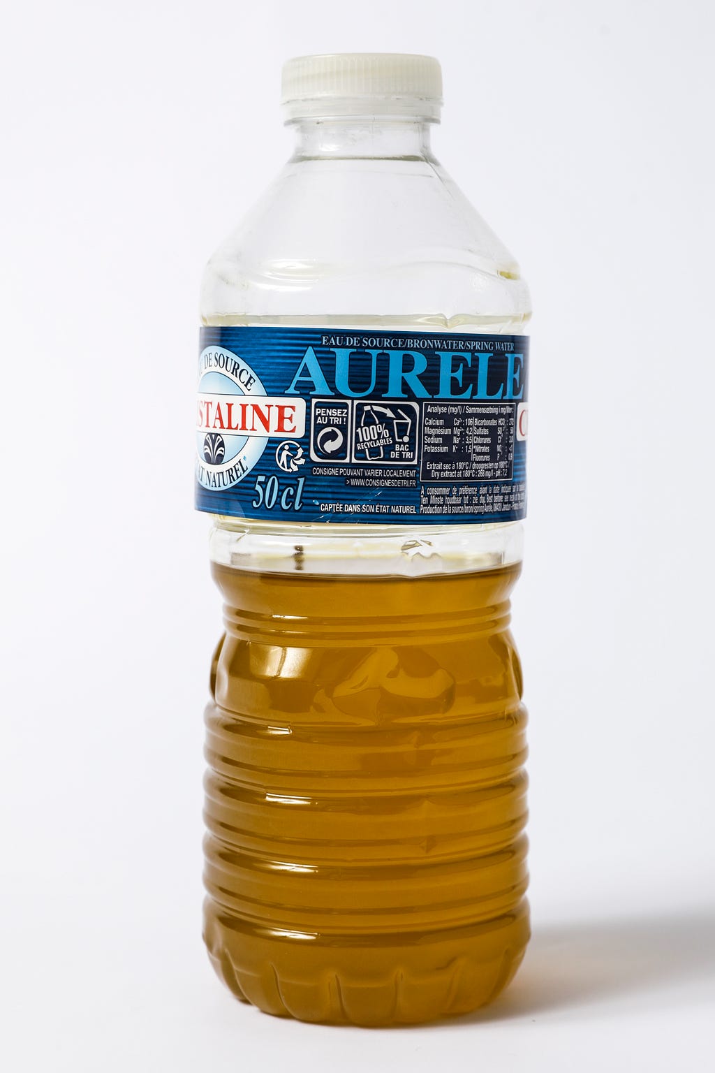 A plastic bottle containing Tunisian olive oil