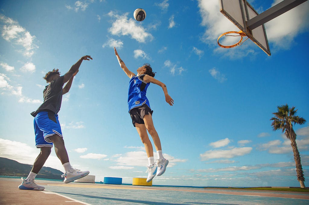 Stock picture, showing a person shooting a basket ball, a who will score (representing the success)