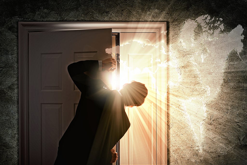 Man opening door letting in bright sunlight