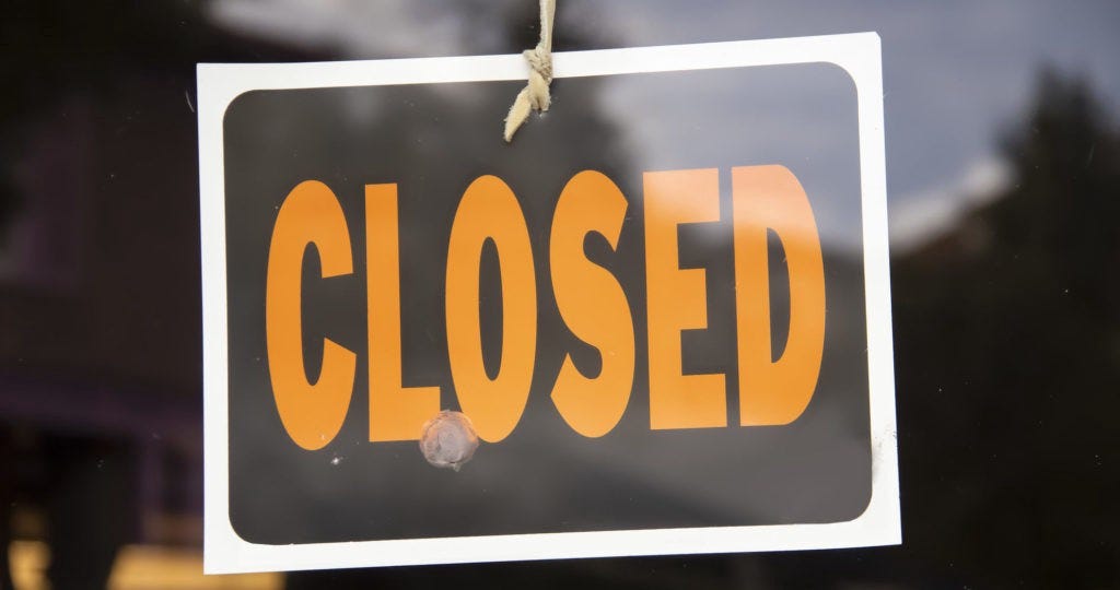 closed sign on a business