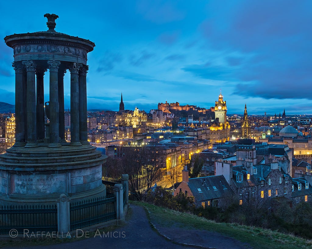 Calton Hill looking over Edinburgh Scotland just after sunset during blue hour