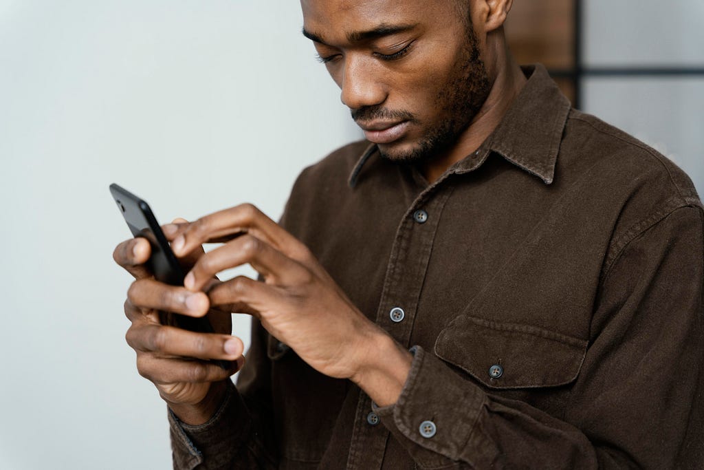 Blind man using a smartphone.