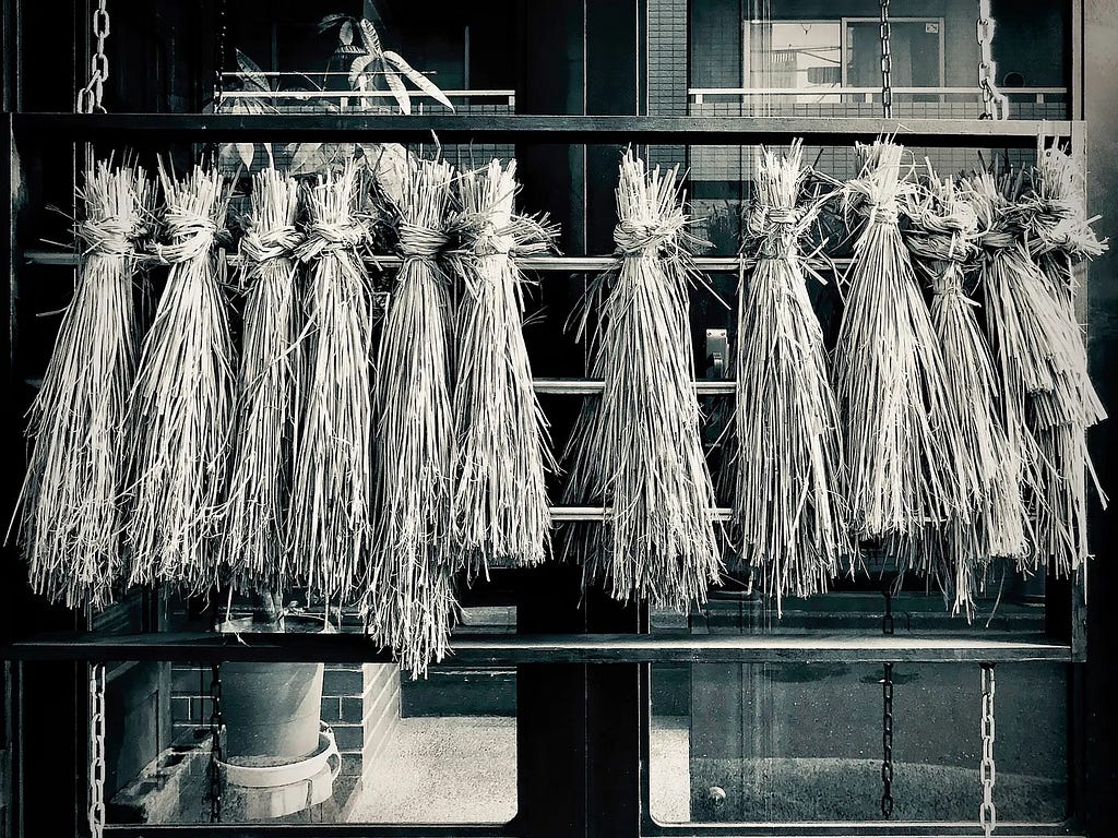 straw hanging on a rail