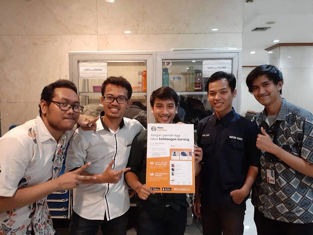 Mata Kampus team, in front of Universitas Pertamina’s lost and found glass cabinet.