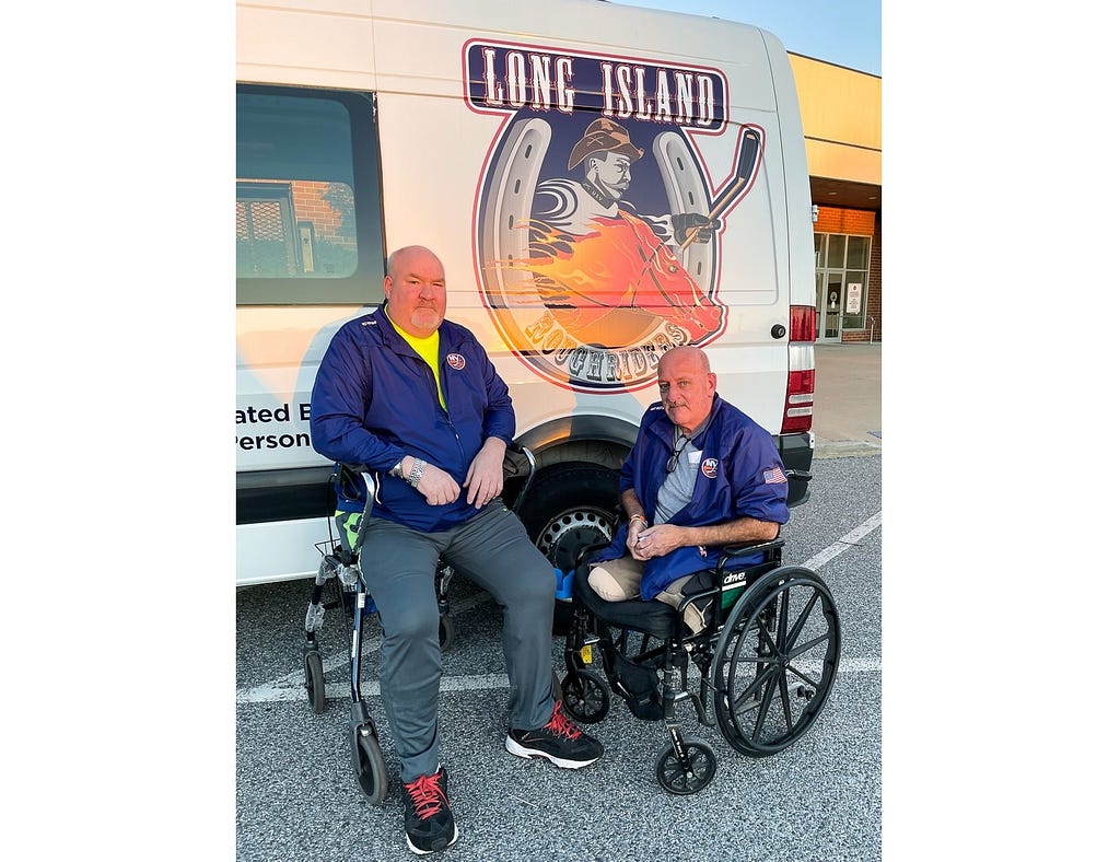 A photo of Kevin McNeil and Frank Martin with the Long Island Sled Hockey Van
