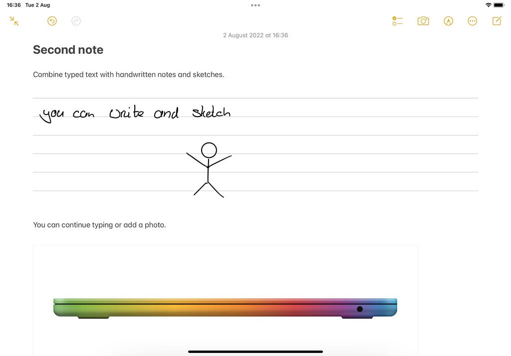 Screenshot of Apple Notes with handwritten note and an image of a MacBook Air in rainbow colors.