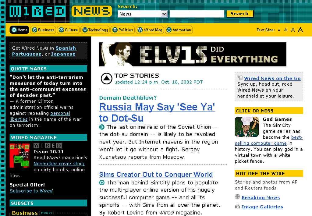 Screenshot of the Wired News homepage (in a desktop browser) from soon after the redesign launch in 2002, showing a green and yellow color scheme, navigation, a single ad banner, a couple of news stories, and two sidebars of additional content.