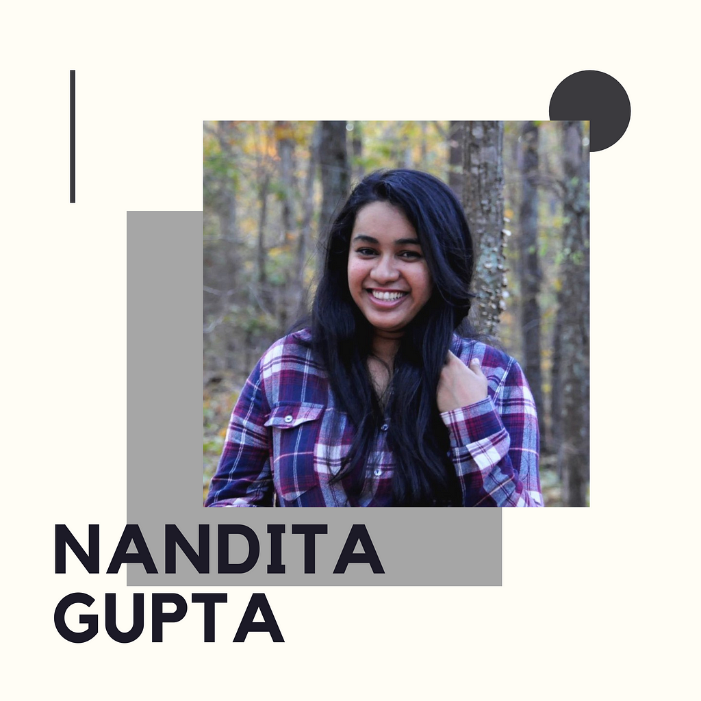 Nandita Gupta wearing a plaid purple shirt, smiling at the camera, with trees behind her.