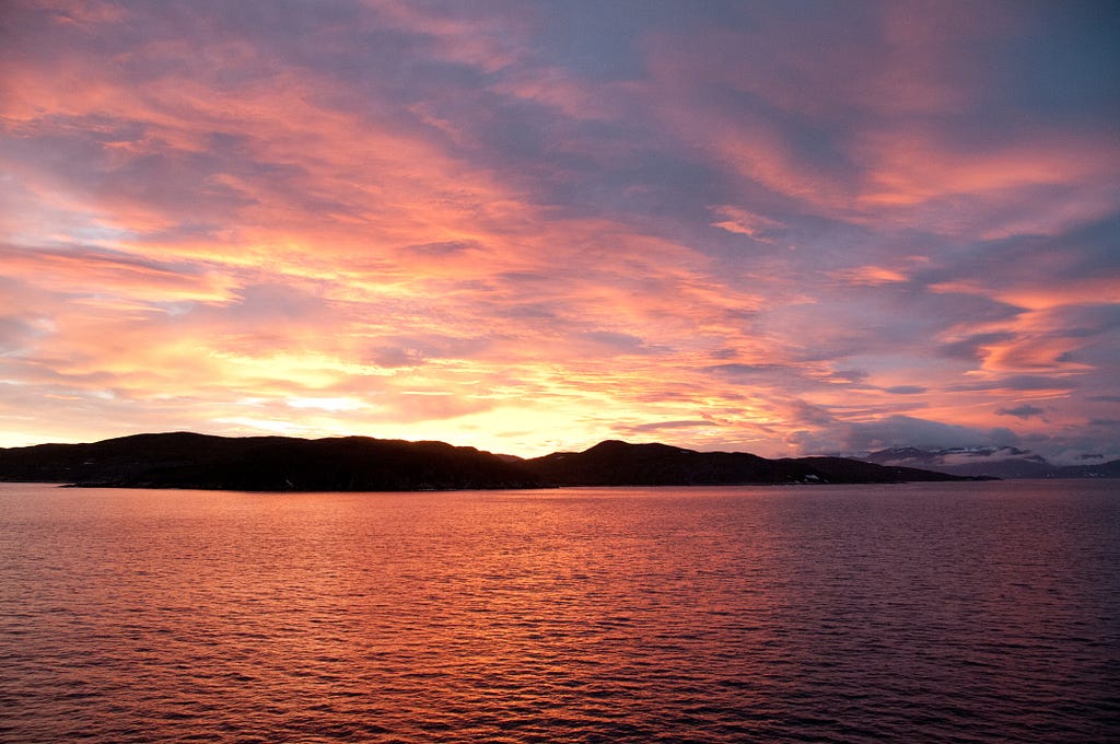 A brilliant sunset paints the sky and waters of the sound near Otak in Labrador in northeastern Canada.