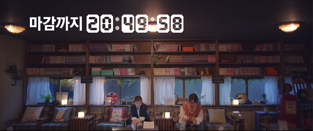 Koo Se-ra and a friend sit in a bookstore. A count-down clock ticks down the time left for Se-ra to submit her application.