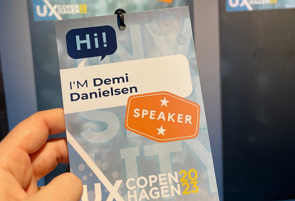 A close-up photograph of Demi Daniel’s speaker pass at the conference showing a typing error on her name. It says ‘Hi! I’m Demi Danielsen’. Demi’s real surname is Daniels.