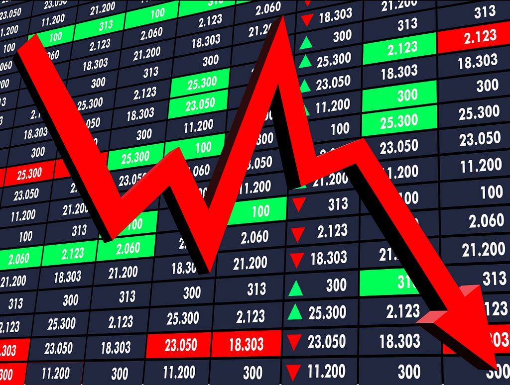 big red arrow going down on the screen display economic stock trading business numbers graph