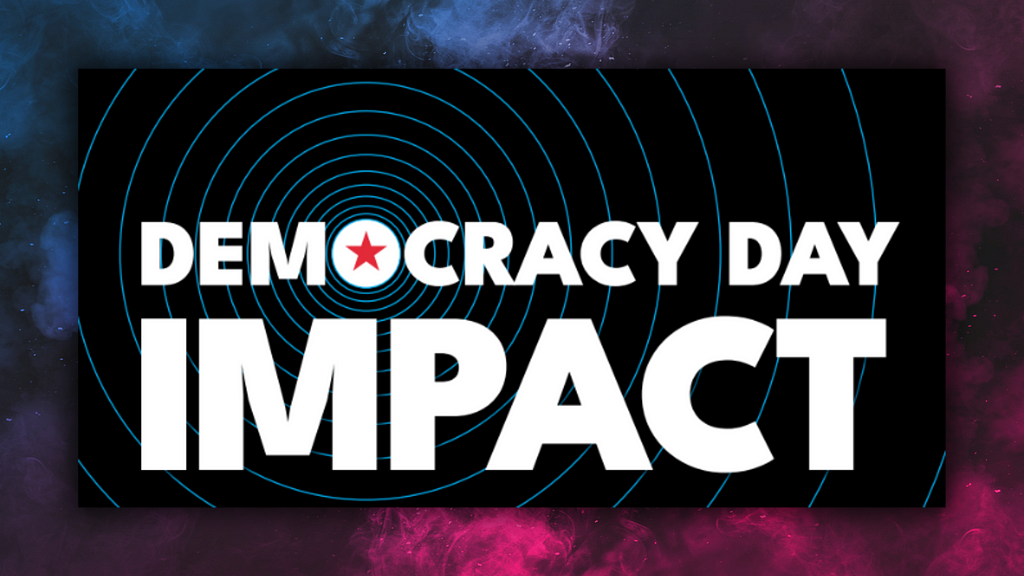Promotional graphic with the words ‘DEMOCRACY DAY IMPACT’ in bold, white letters, centered over a black background with concentric blue rings emanating from a red star. The background fades into a cosmic nebula with swirls of blue and purple hues, suggesting a theme of significance and universal reach.