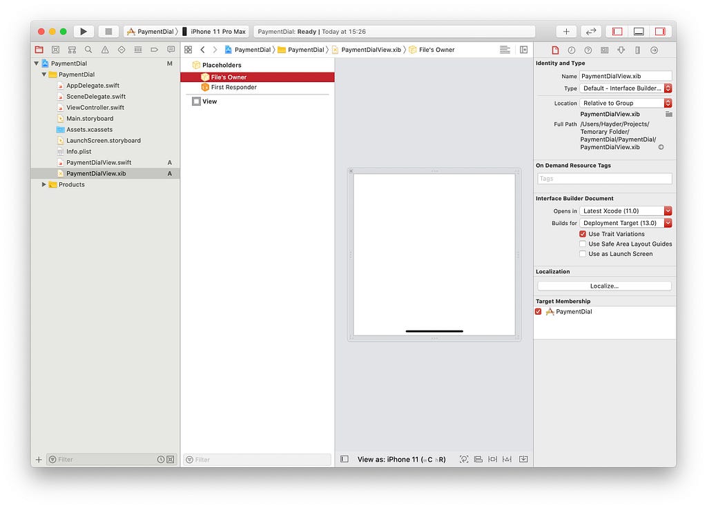 An Xcode window, showing the content of the payment dial view nib file and how to disable safe area layout guides