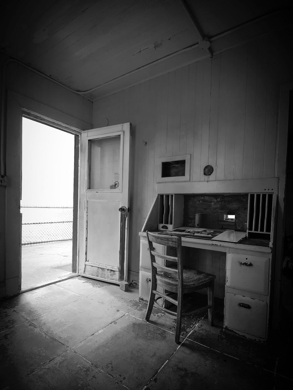 White wooden door open in an old home office.