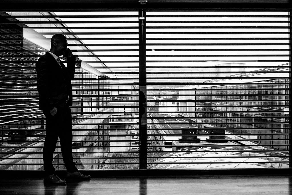 man in suit on the phone
