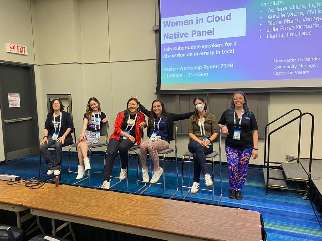 Six women in a panel at a conference