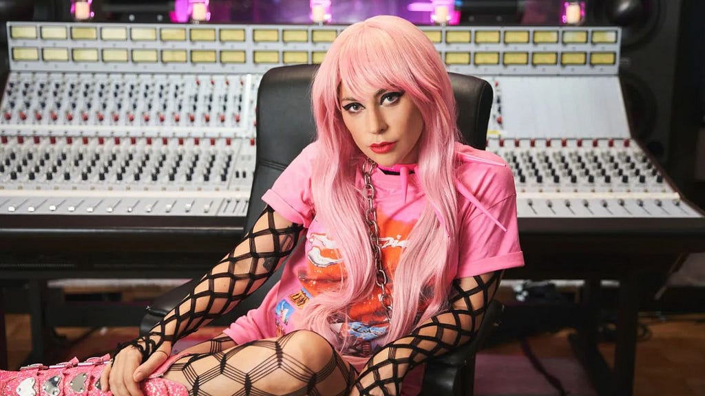 Lady Gaga sitting at audio mixer