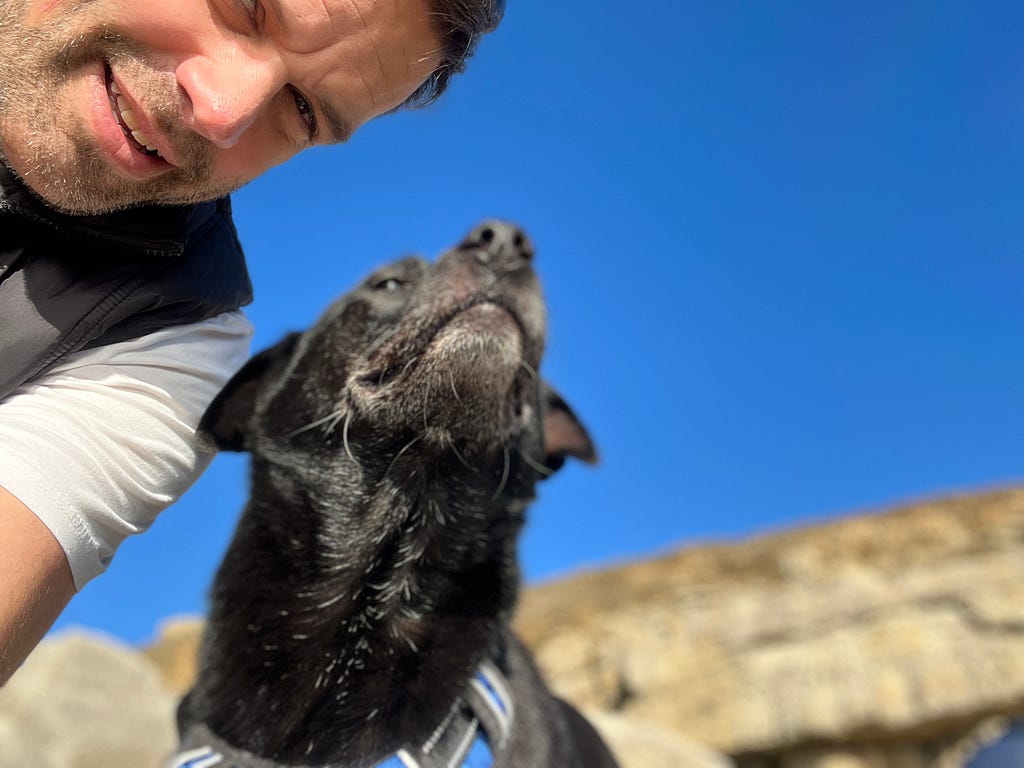 Author (Mike Rose) and his dog with a blue sky background