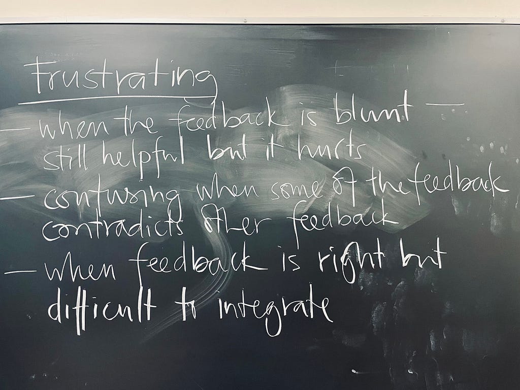 Image of a university blackboard with the heading: Frustrating, and bullet points that read "when the feedback is blunt still helpful but it hurts," "confusing when some of the feedback contradicts other feedback," and "when feedback is right but difficult to integrate."