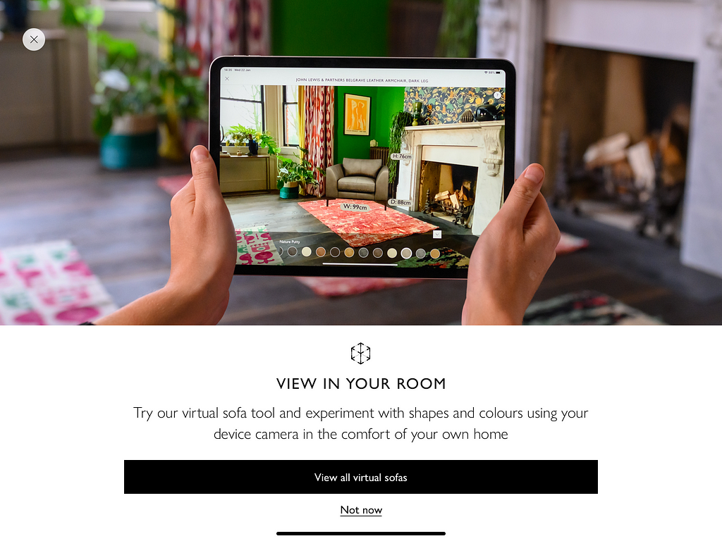 John Lewis Sofa AR feature — user holds iPad in camera mode and sees digital image of a sofa within their own room