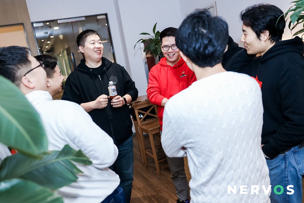 Nervos co-founder Daniel Lv talks with guests during the CKB Mainnet anniversary celebration