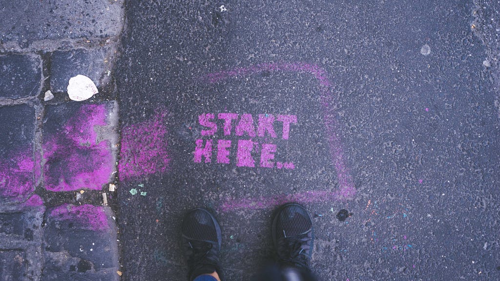 Start here text on the ground.
