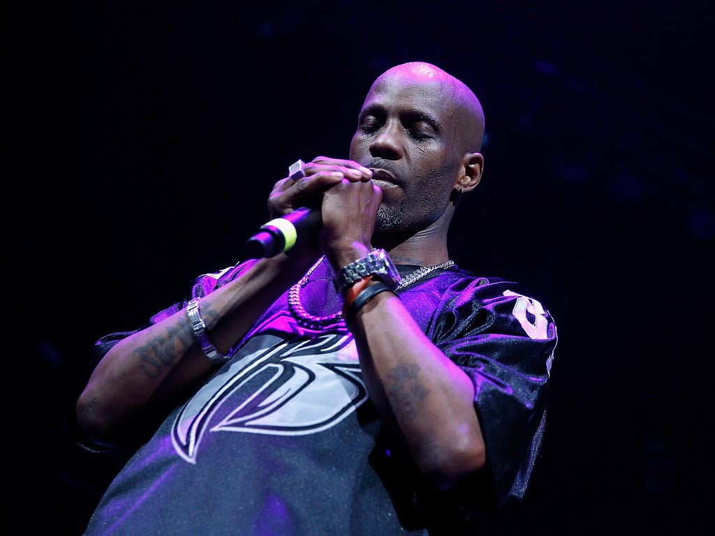 DMX prays during a performance at Barclays Center in Brooklyn, New York on April 21, 2017.