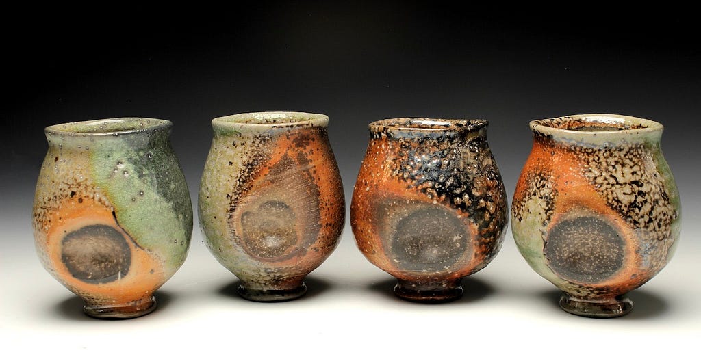 Soda fired cups with an interesting glaze effect