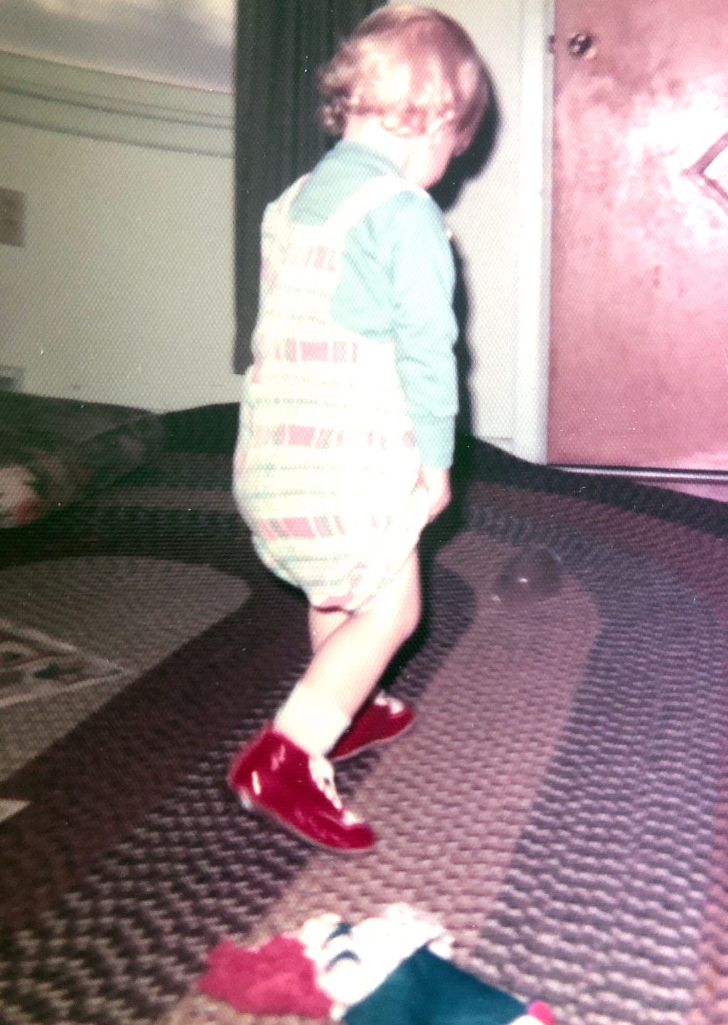 Me at age one walking in orthopedic shoes.